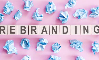 rebranding word written on white blocks on a pink background